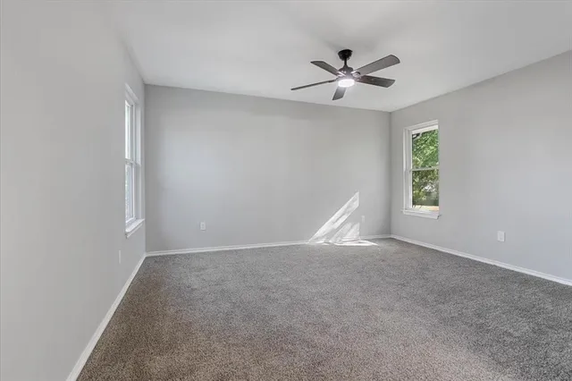 a bathroom with a sink mirror and toilet