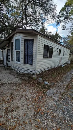 a house with trees in the background