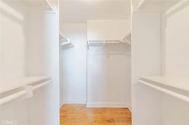 a bathroom with a granite countertop sink mirror and a shower