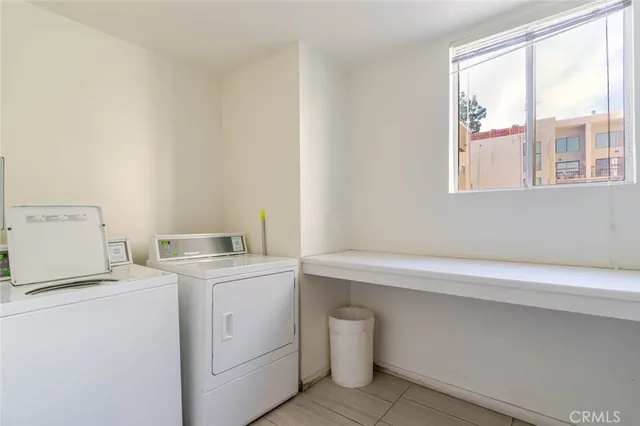 a view of parking garage with cars parked