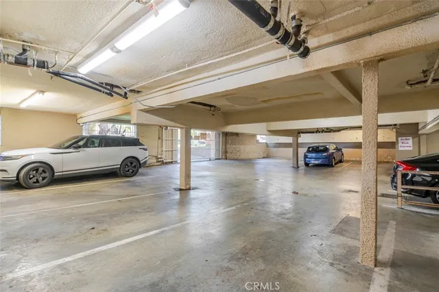 a view of a swimming pool with a fire pit and trees