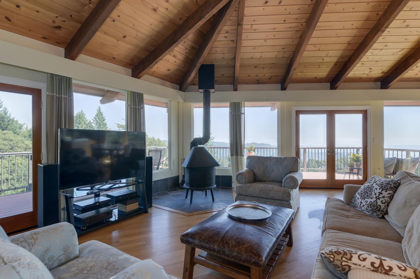 18503 Favre Ridge Road Los Gatos, CA 95033 - Photo 12 of 40 a living room with furniture and a flat screen tv