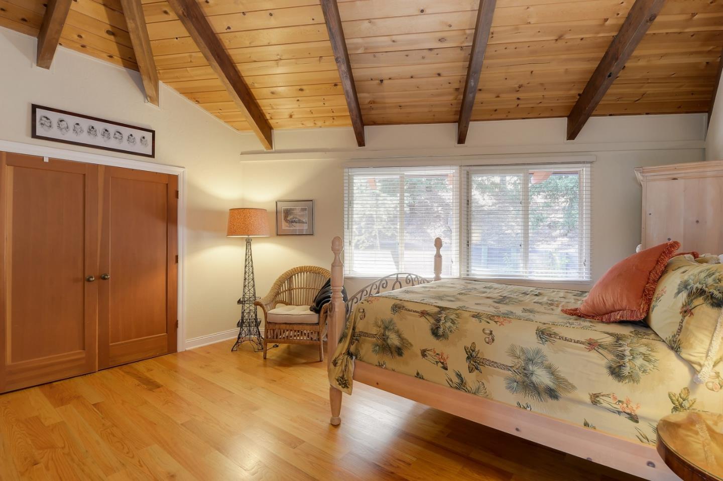 18503 Favre Ridge Road Los Gatos, CA 95033 - Photo 22 of 40 a bedroom with a bed and wooden floor