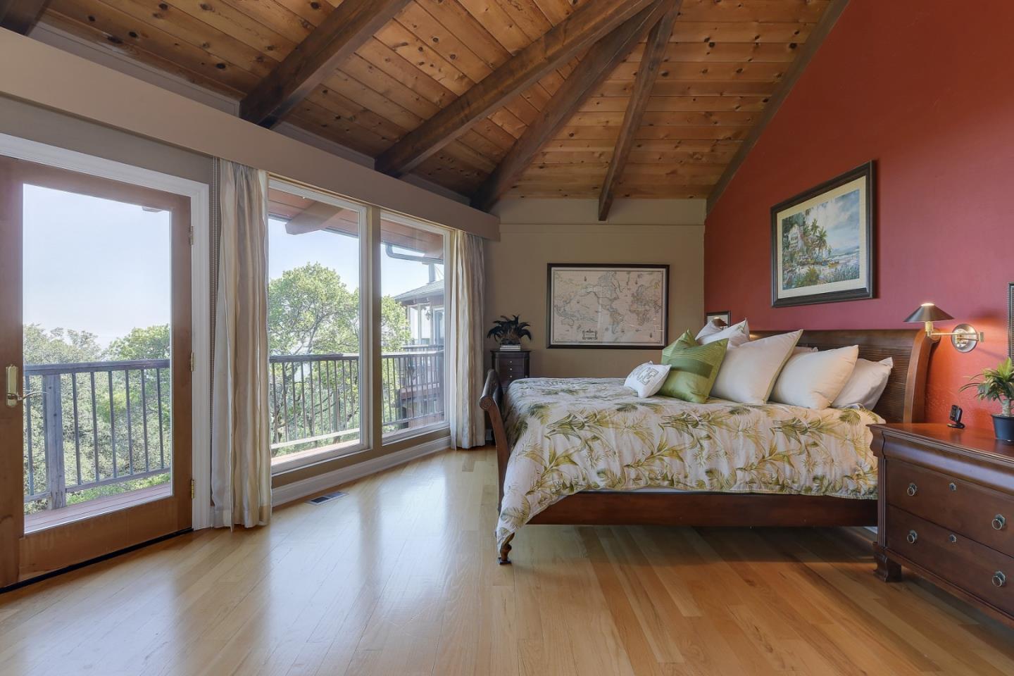 18503 Favre Ridge Road Los Gatos, CA 95033 - Photo 24 of 40 a bedroom with a large bed and a large window