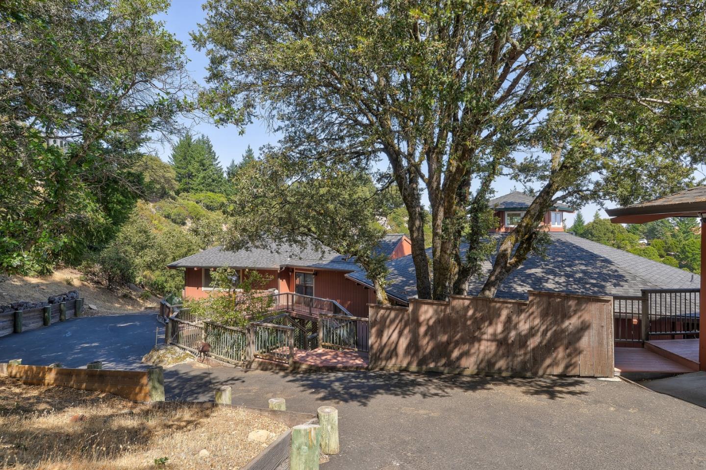 18503 Favre Ridge Road Los Gatos, CA 95033 - Photo 3 of 40 a view of a house with a tree
