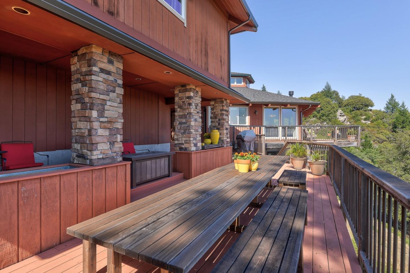 18503 Favre Ridge Road Los Gatos, CA 95033 - Photo 31 of 40 a view of a balcony with wooden floor and outdoor seating