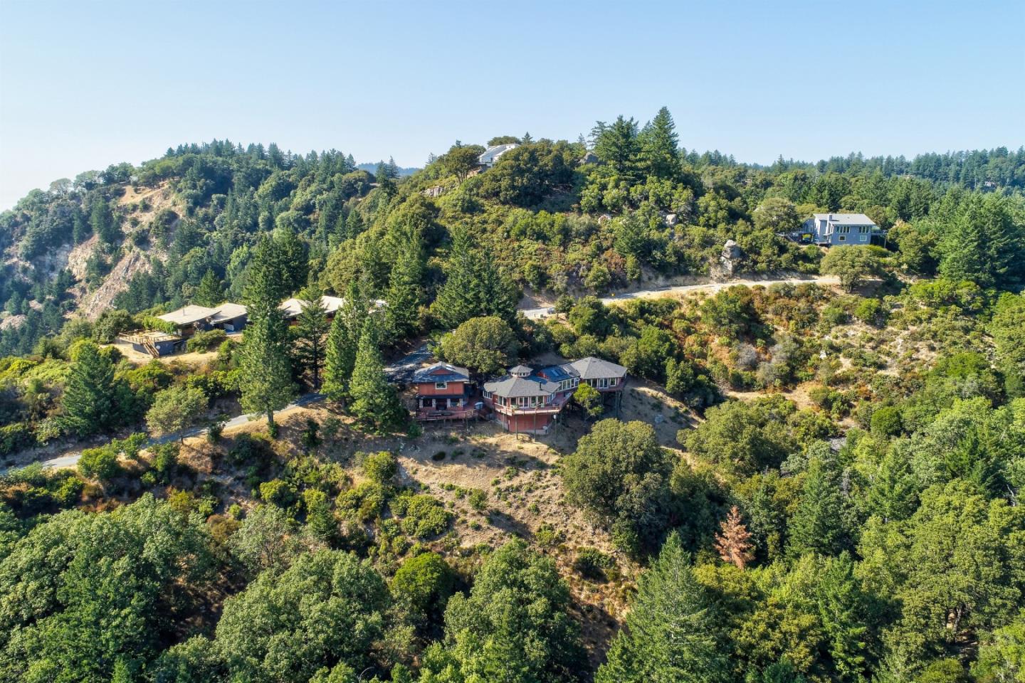 18503 Favre Ridge Road Los Gatos, CA 95033 - Photo 36 of 40 a view of a house with a street lush green forest