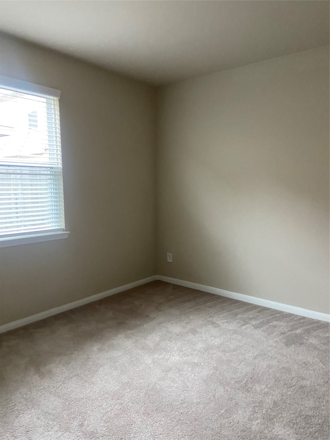 18614 Cooper Ravine Way Katy, TX 77449 - Photo 7 of 9 an empty room with a window