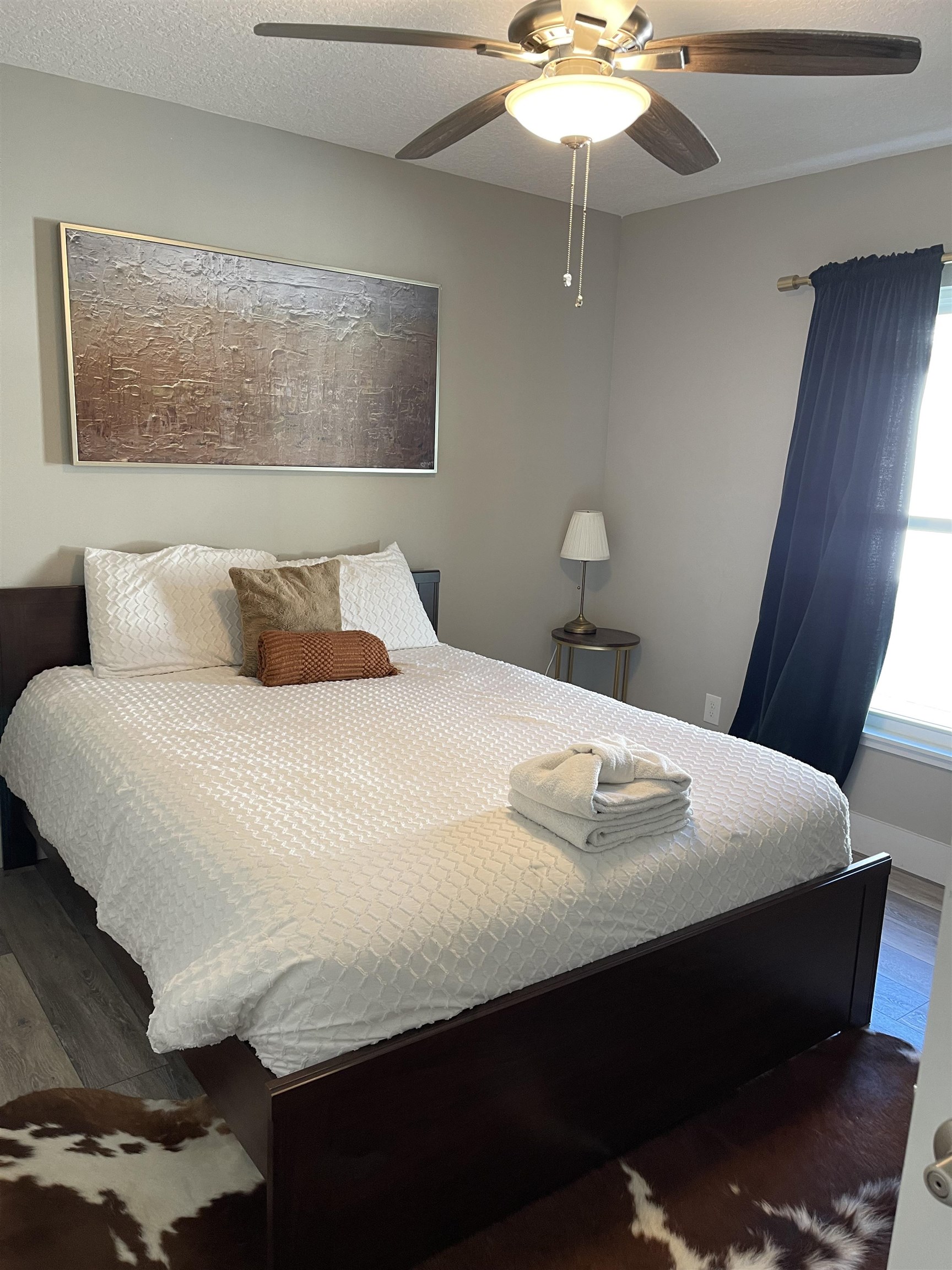 18 Comares Avenue St. Augustine, FL 32080 - Photo 14 of 18 a bedroom with a bed and a chandelier