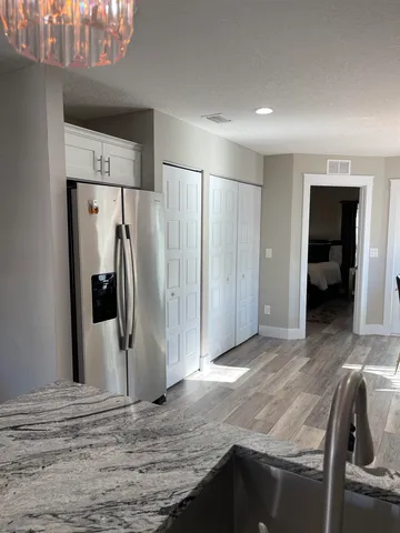 a bedroom with a bed and dresser