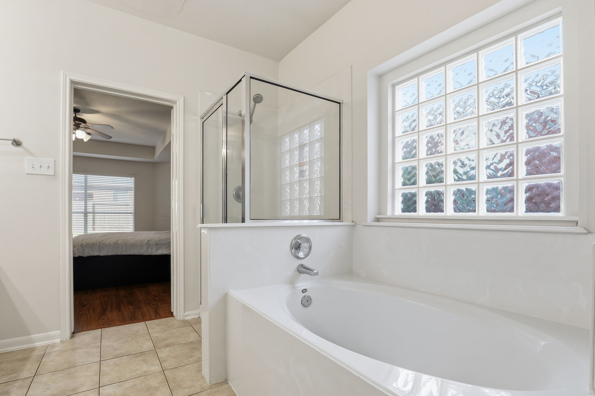 30615 Winlock Trails Drive Spring, TX 77386 - Photo 15 of 33 a bathroom with a bathtub and a shower