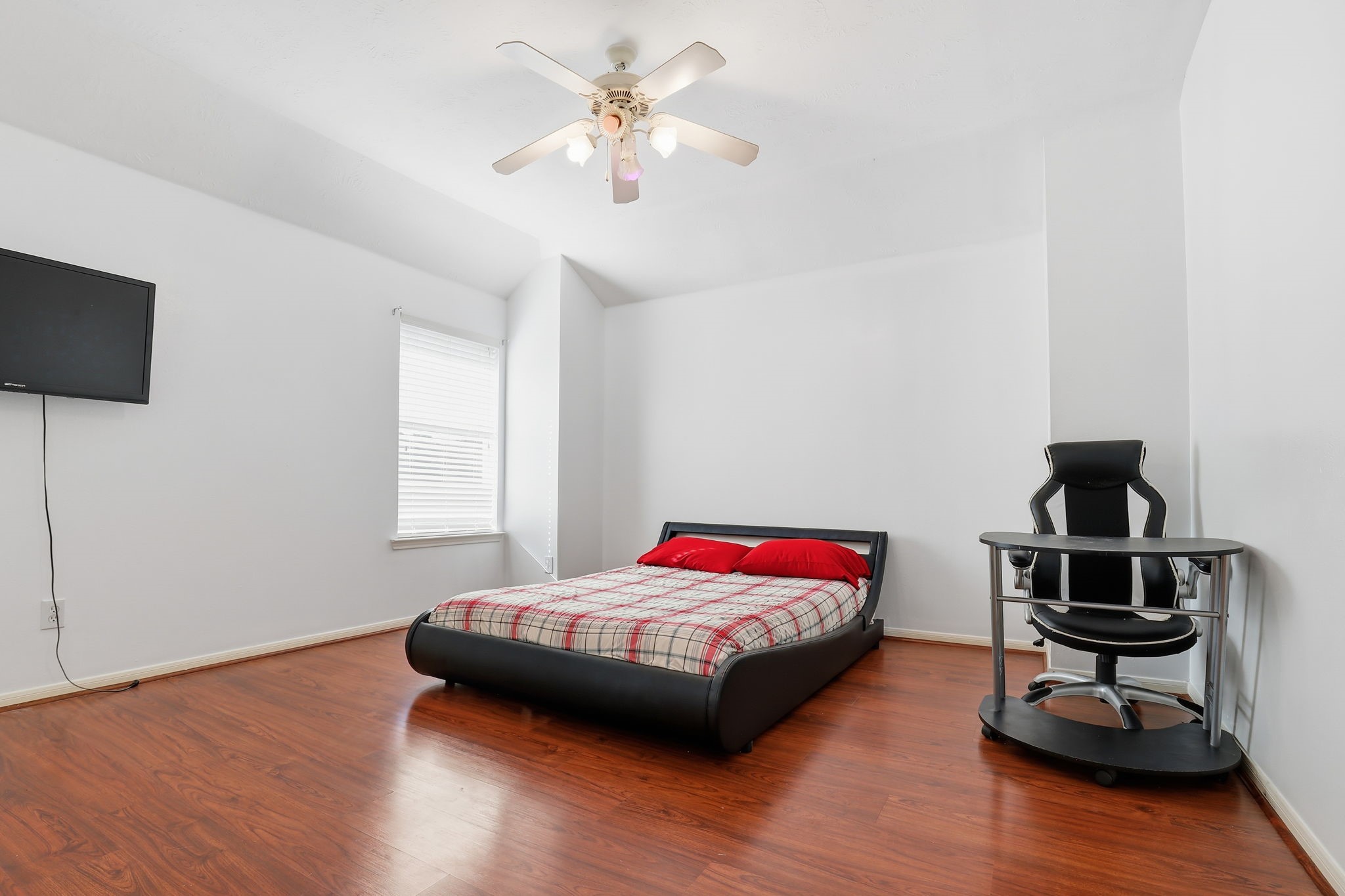 30615 Winlock Trails Drive Spring, TX 77386 - Photo 24 of 33 a bedroom with a bed and a chandelier