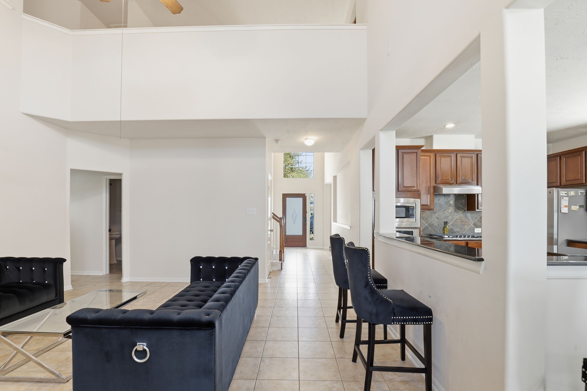 30615 Winlock Trails Drive Spring, TX 77386 - Photo 10 of 33 a living room with furniture and a flat screen tv