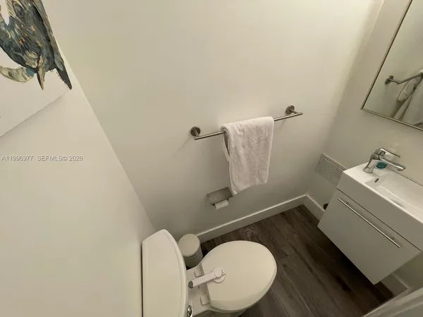 a bathroom with a sink and toilet