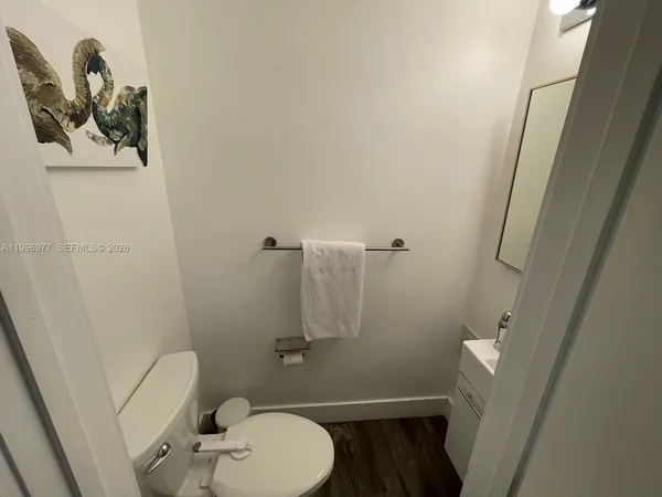 a bathroom with a toilet and a sink