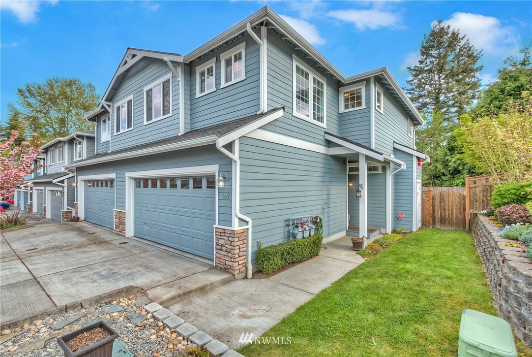 902 225th Place Southeast Bothell, WA 98021 - Photo 1 of 20 a front view of a house with a yard and porch