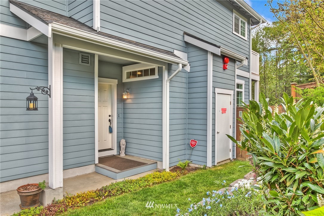 902 225th Place Southeast Bothell, WA 98021 - Photo 2 of 20 a backyard of a house with plants and entertaining space
