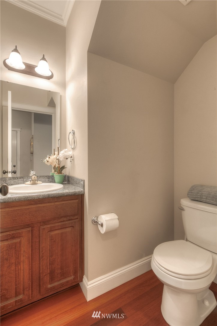 902 225th Place Southeast Bothell, WA 98021 - Photo 13 of 20 a bathroom with a granite countertop toilet and a sink