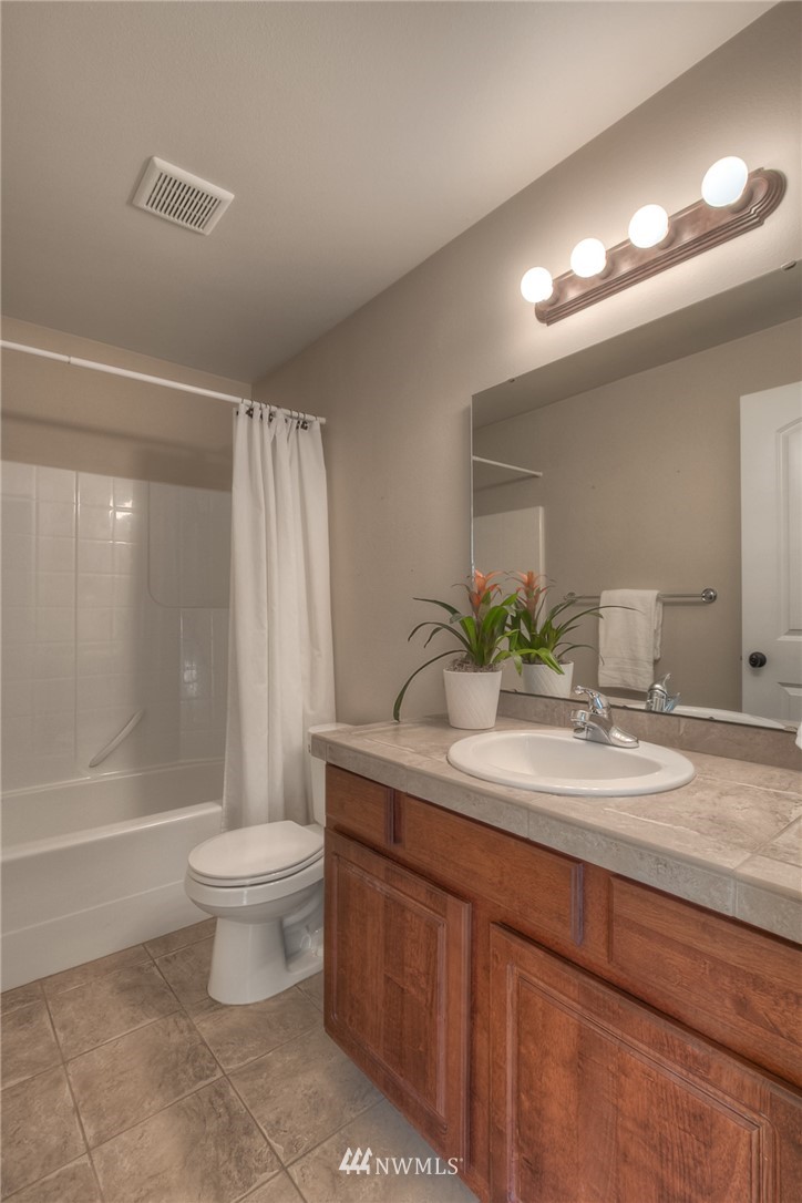902 225th Place Southeast Bothell, WA 98021 - Photo 14 of 20 a bathroom with a sink a toilet and shower