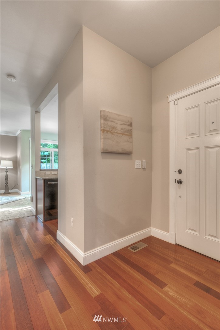 902 225th Place Southeast Bothell, WA 98021 - Photo 3 of 20 an empty room with wooden floor and windows