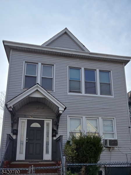 449 East 26th Street Paterson, NJ 07514 - Photo 1 of 9 a front view of a house with a yard