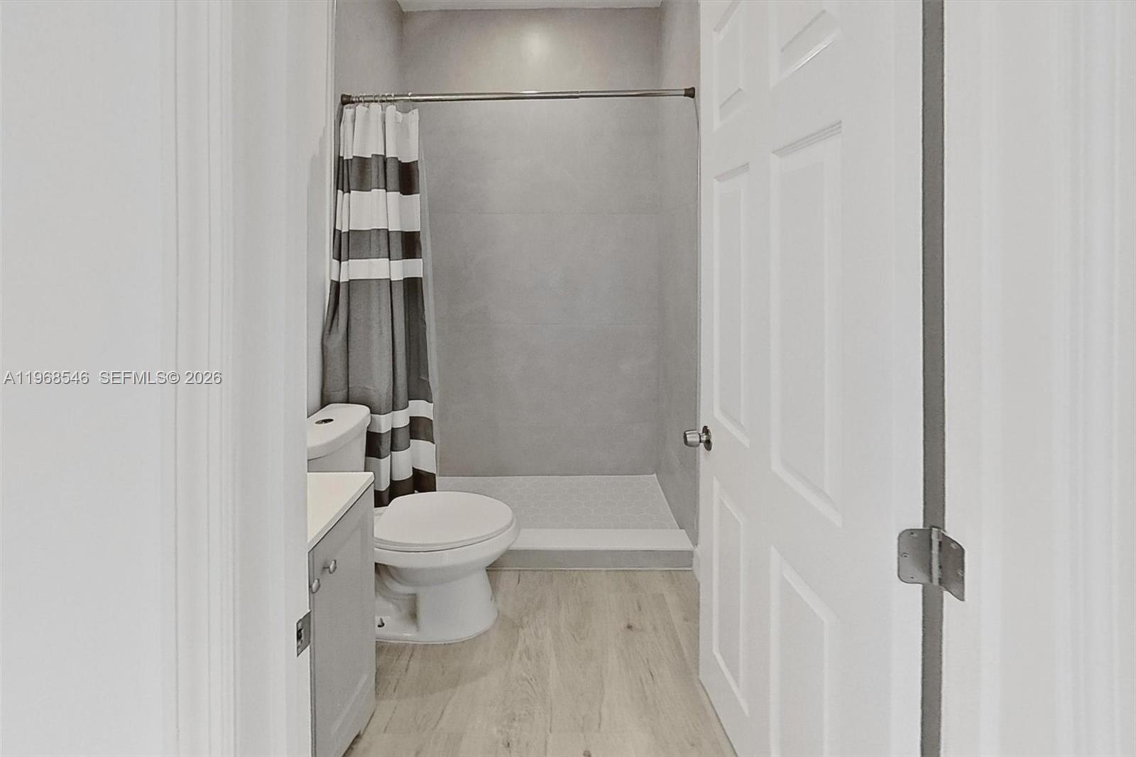 4237 Southwest 7th Street Miami, FL 33134 - Photo 19 of 31 a bathroom with a sink a toilet and shower
