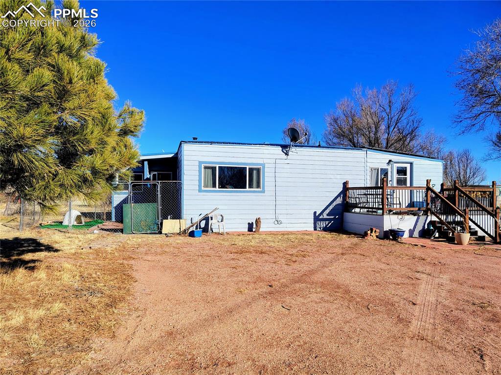 24405 Handle Road Calhan, CO 80808 - Photo 1 of 30 a view of a house with a snow in the yard