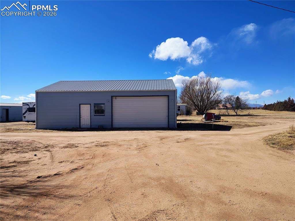 24405 Handle Road Calhan, CO 80808 - Photo 11 of 30 a view of a house with a snow in it