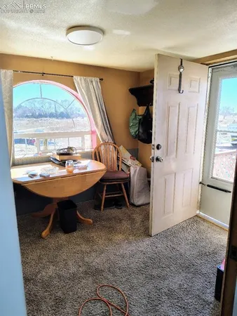 a view of a livingroom with furniture and window