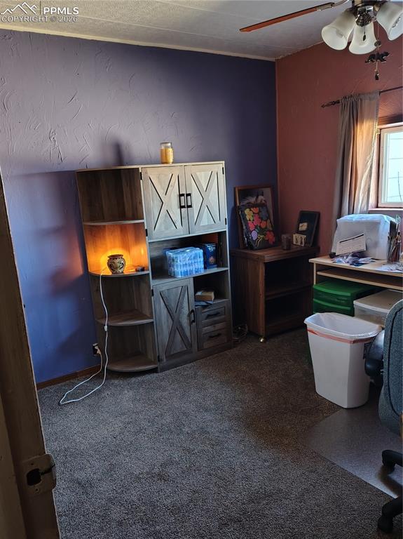 24405 Handle Road Calhan, CO 80808 - Photo 9 of 30 a room with furniture and window