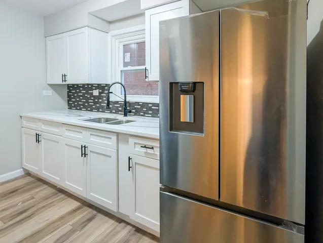 a bathroom with a stove and a microwave