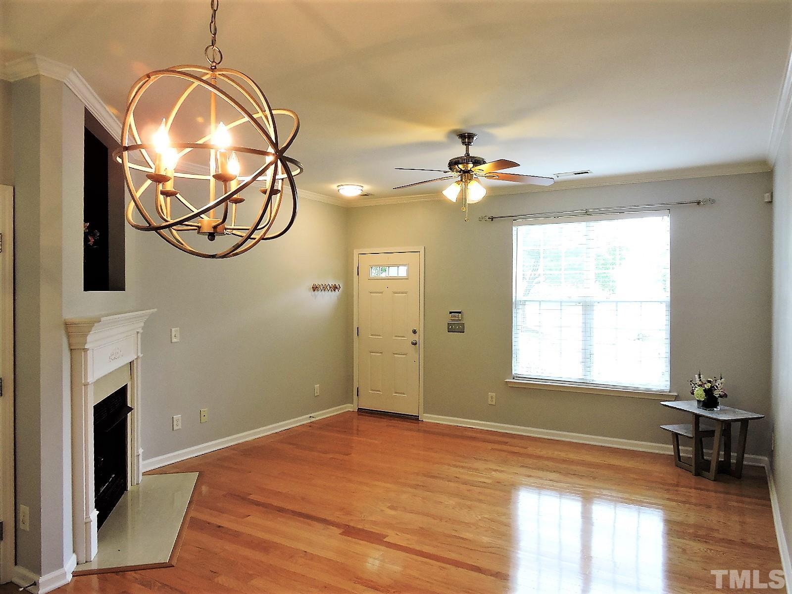 3811 Ramblewood Avenue Durham, NC 27713 - Photo 11 of 29 a view of a livingroom with a window and wooden floor