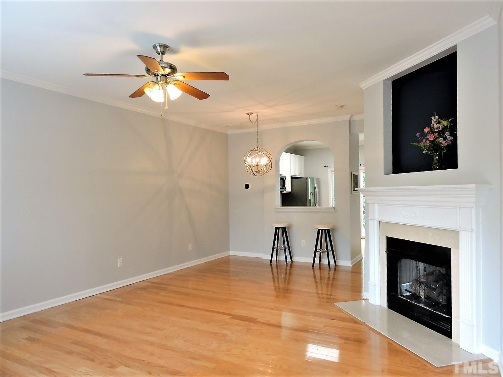 3811 Ramblewood Avenue Durham, NC 27713 - Photo 12 of 29 a view of a livingroom with a fireplace and fan