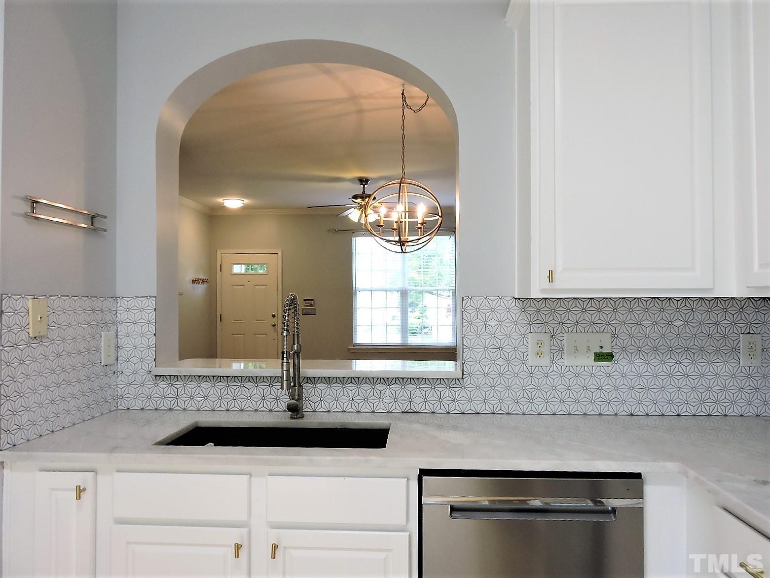 3811 Ramblewood Avenue Durham, NC 27713 - Photo 18 of 29 a bathroom with a sink and a mirror