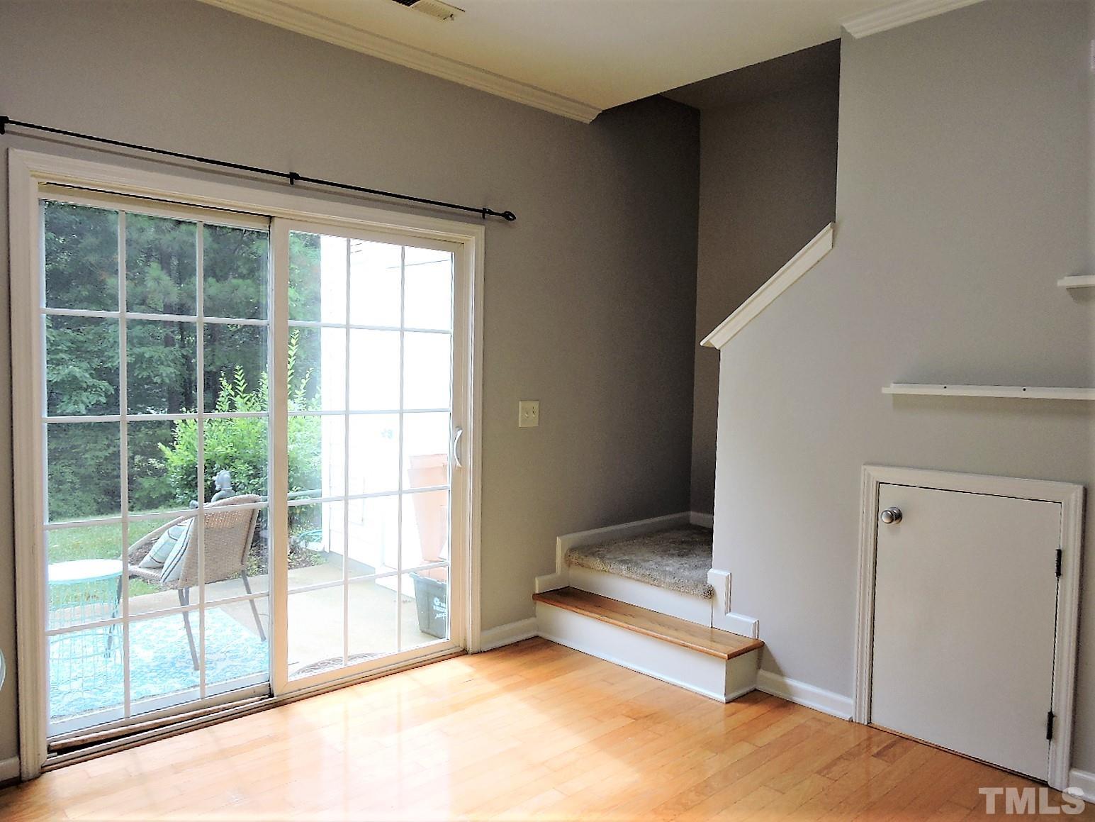 3811 Ramblewood Avenue Durham, NC 27713 - Photo 19 of 29 a view of room with window and floor to ceiling window