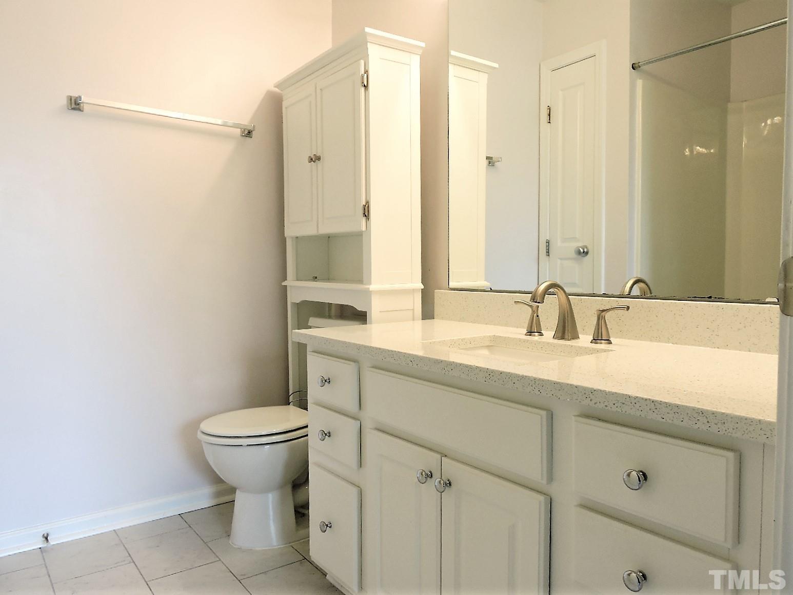 3811 Ramblewood Avenue Durham, NC 27713 - Photo 23 of 29 a bathroom with a granite countertop sink toilet and shower