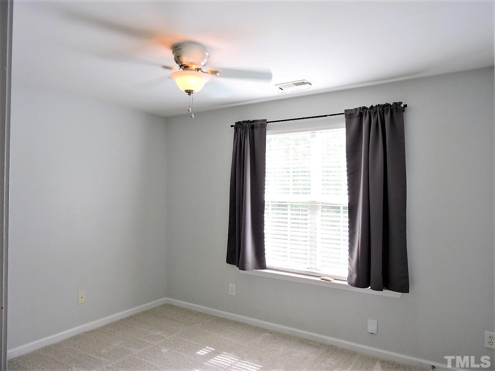 3811 Ramblewood Avenue Durham, NC 27713 - Photo 24 of 29 a view of an empty room with a window