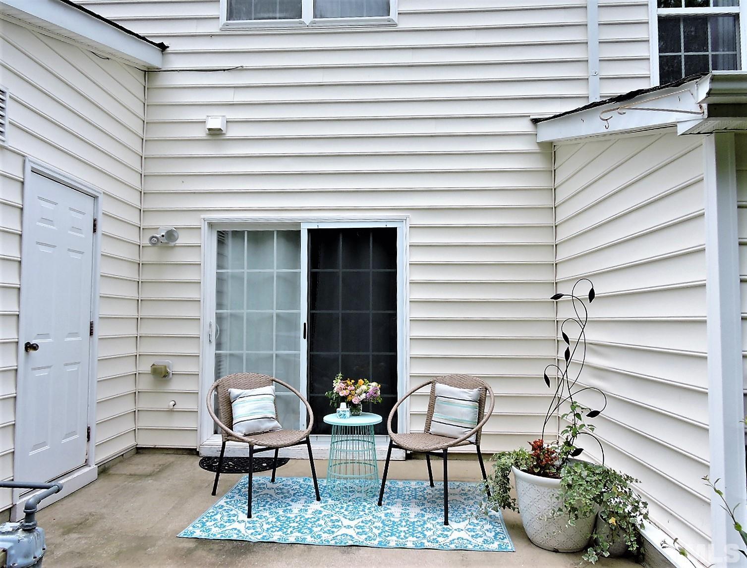 3811 Ramblewood Avenue Durham, NC 27713 - Photo 25 of 29 a view of a chairs and table in patio