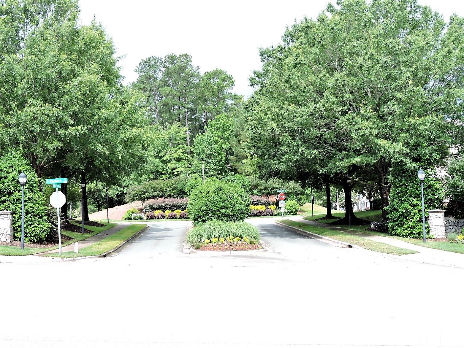 3811 Ramblewood Avenue Durham, NC 27713 - Photo 28 of 29 a view of a street with houses