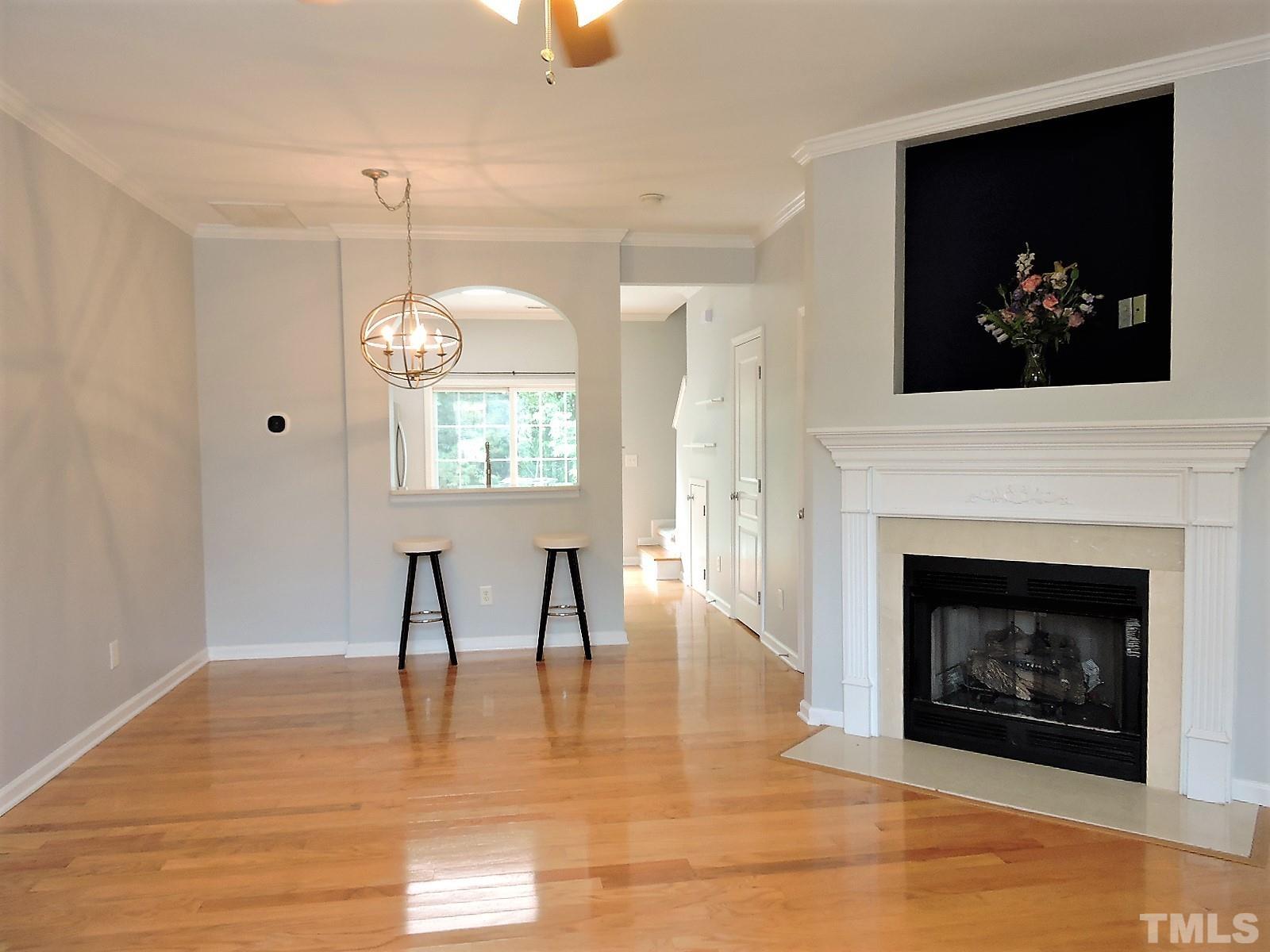 3811 Ramblewood Avenue Durham, NC 27713 - Photo 6 of 29 a view of a livingroom with a fireplace and window