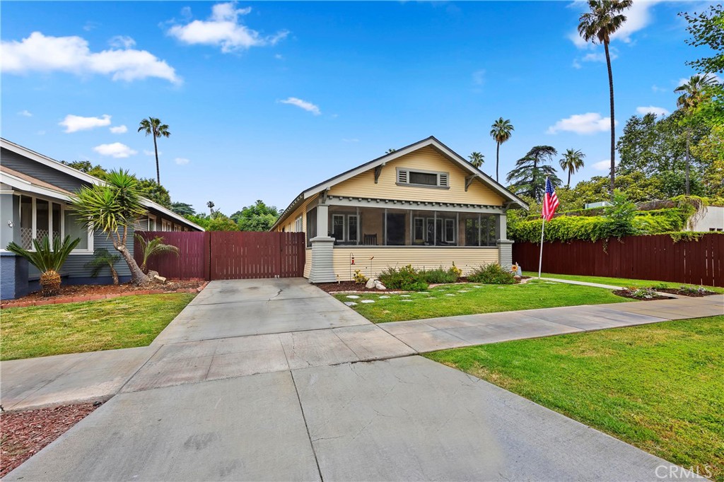 3525 Pine Street Riverside, CA 92501 - Photo 1 of 1 a front view of a house with a yard and garage