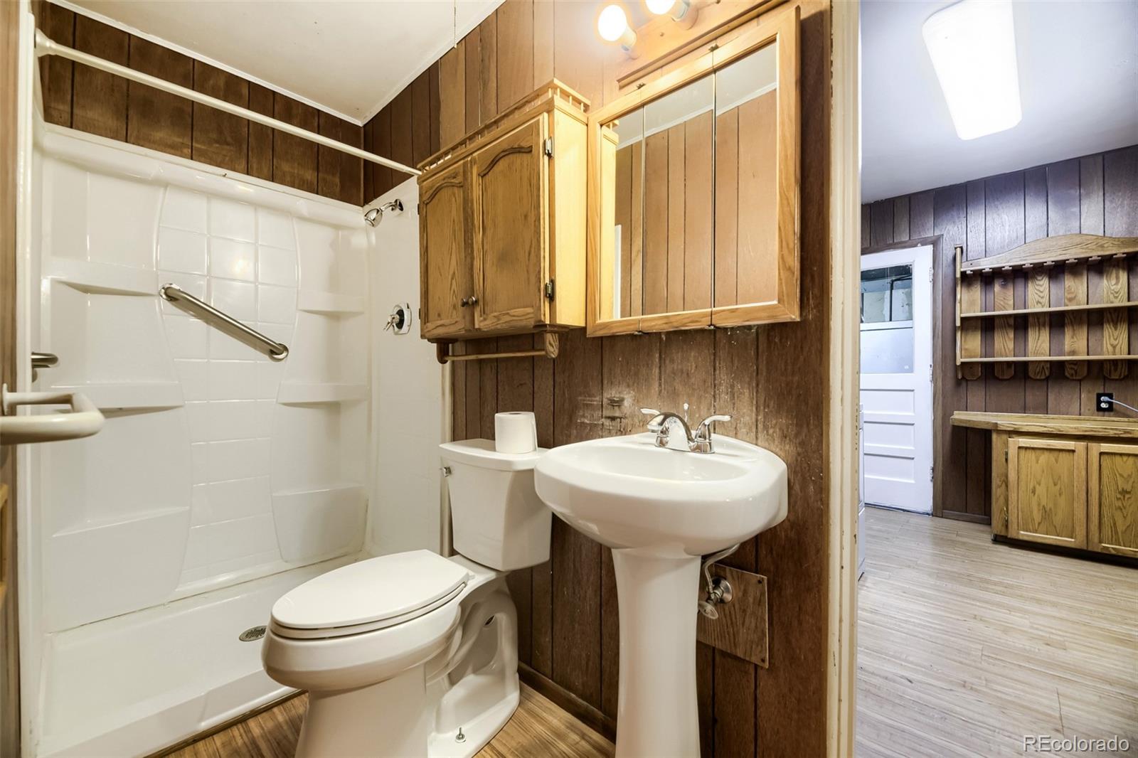1521 Ruth Drive Thornton, CO 80229 - Photo 13 of 23 a bathroom with a sink a toilet and shower