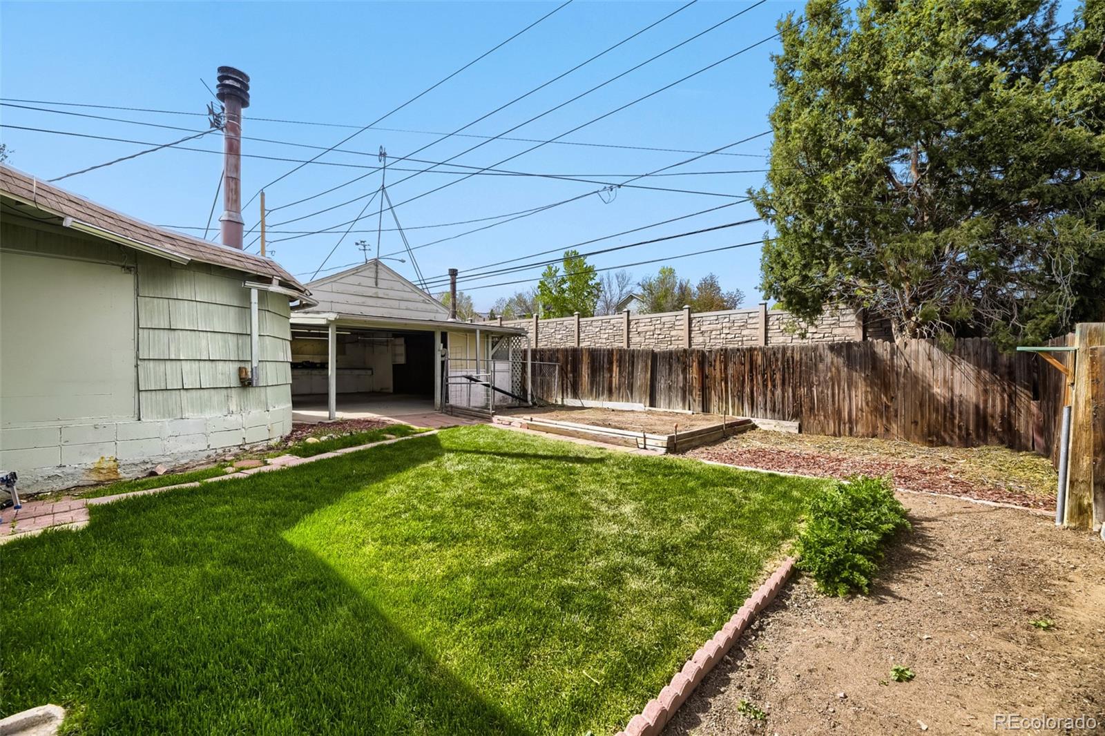 1521 Ruth Drive Thornton, CO 80229 - Photo 21 of 23 a view of a house with backyard and sitting area