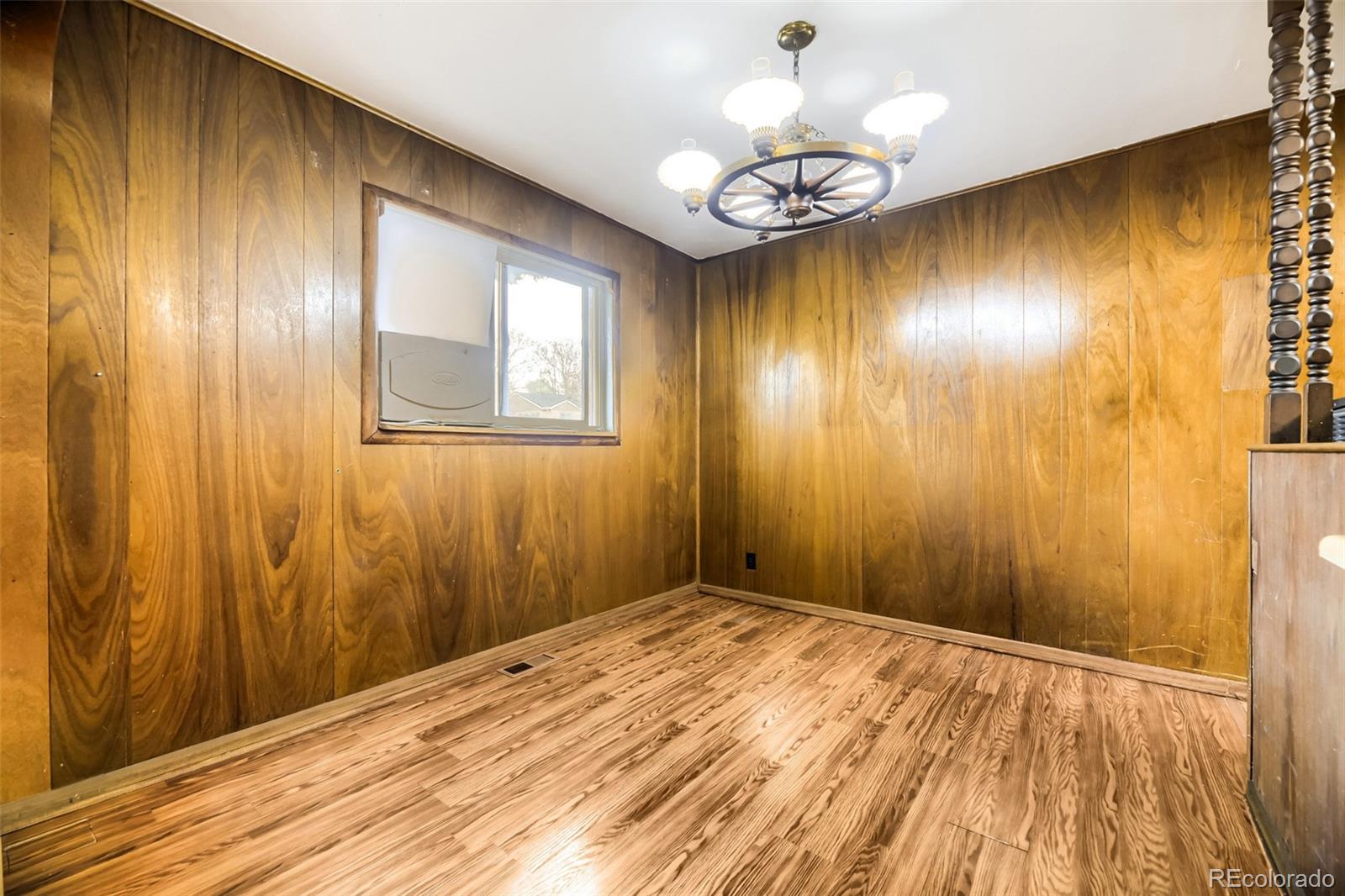 1521 Ruth Drive Thornton, CO 80229 - Photo 3 of 23 a view of empty room with wooden floor