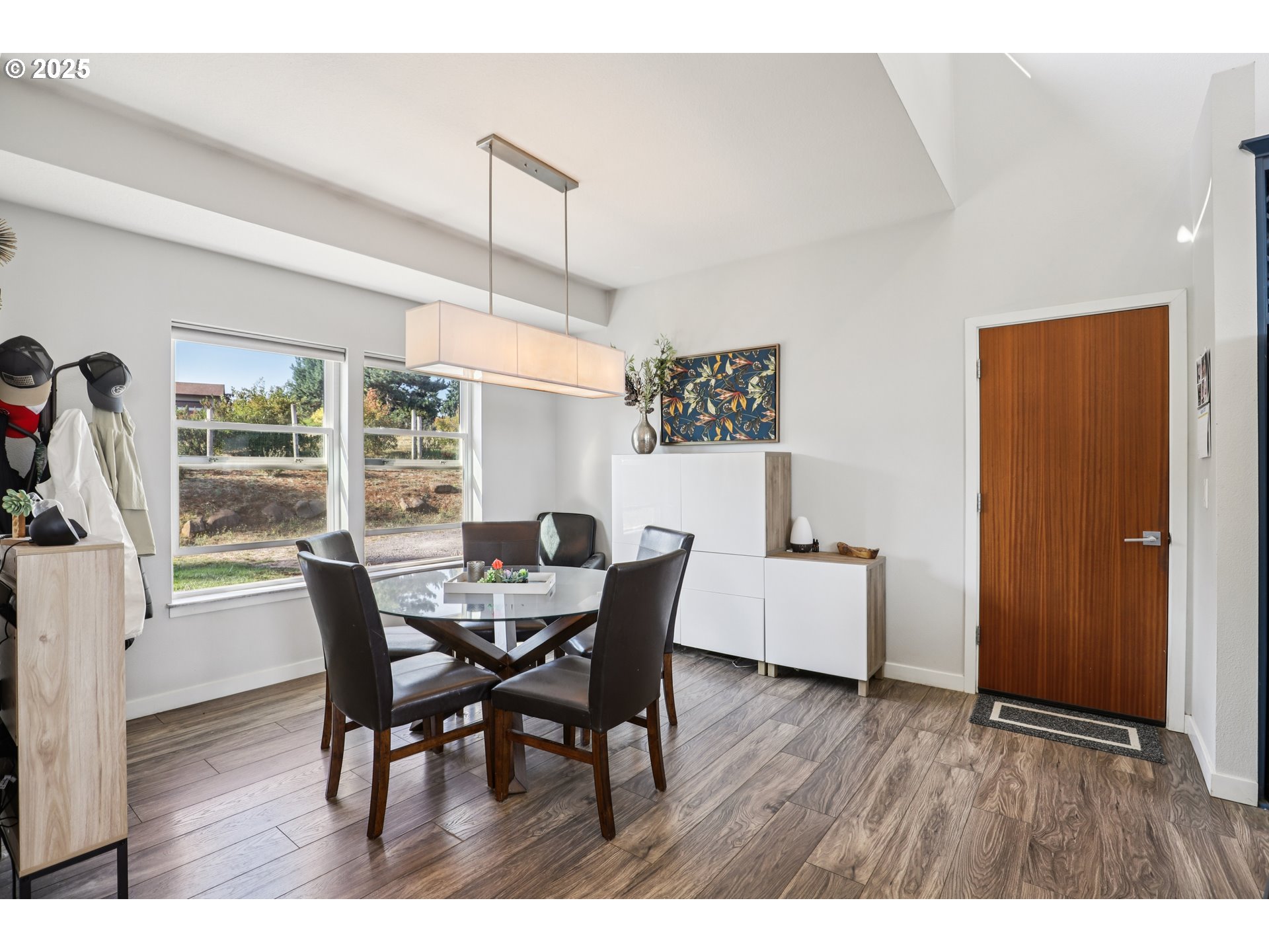 13005 South Casto Road Oregon City, OR 97045 - Photo 11 of 43 a dining room with furniture and wooden floor