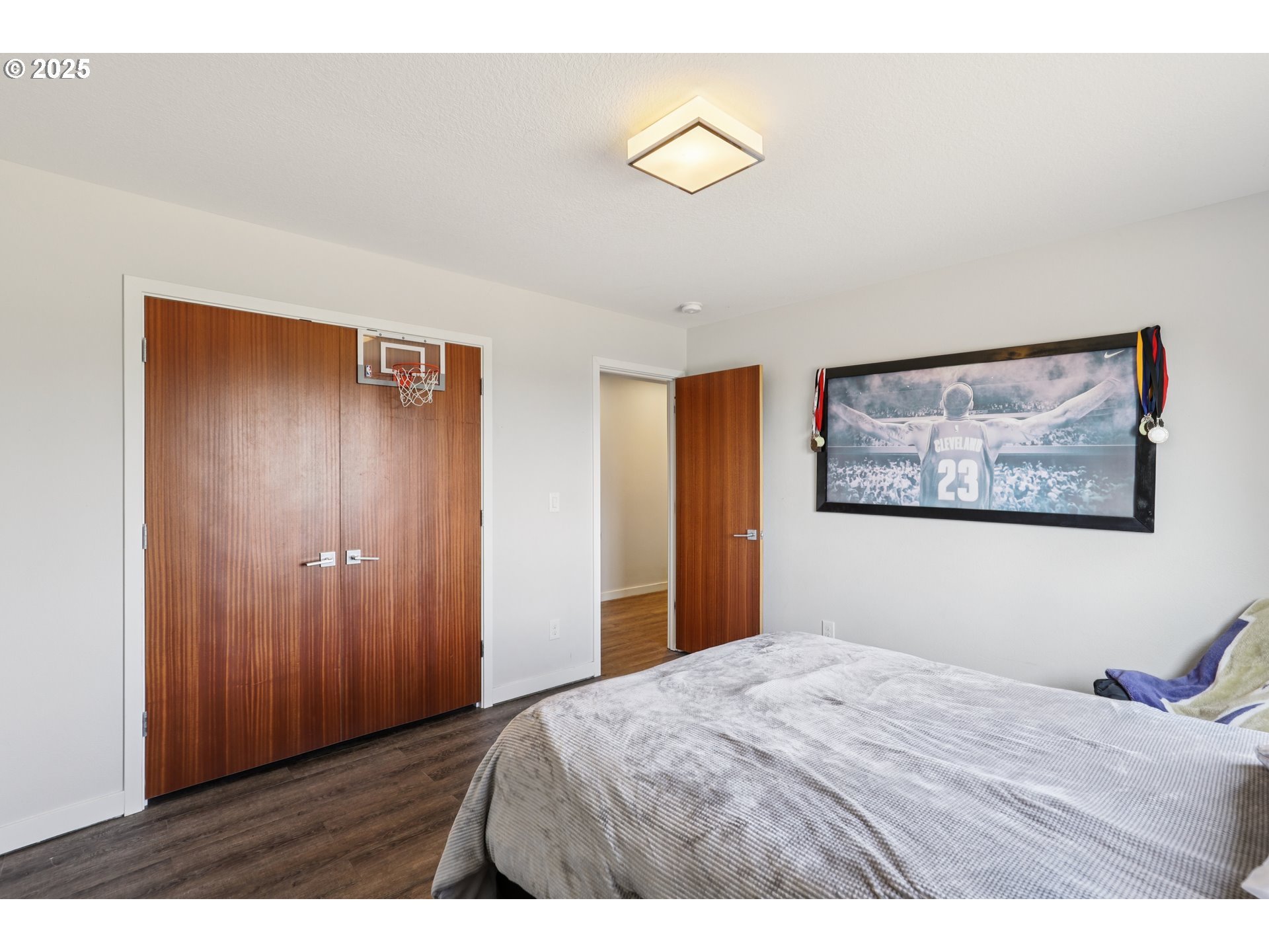 13005 South Casto Road Oregon City, OR 97045 - Photo 27 of 43 a bedroom with a bed and a painting on the wall