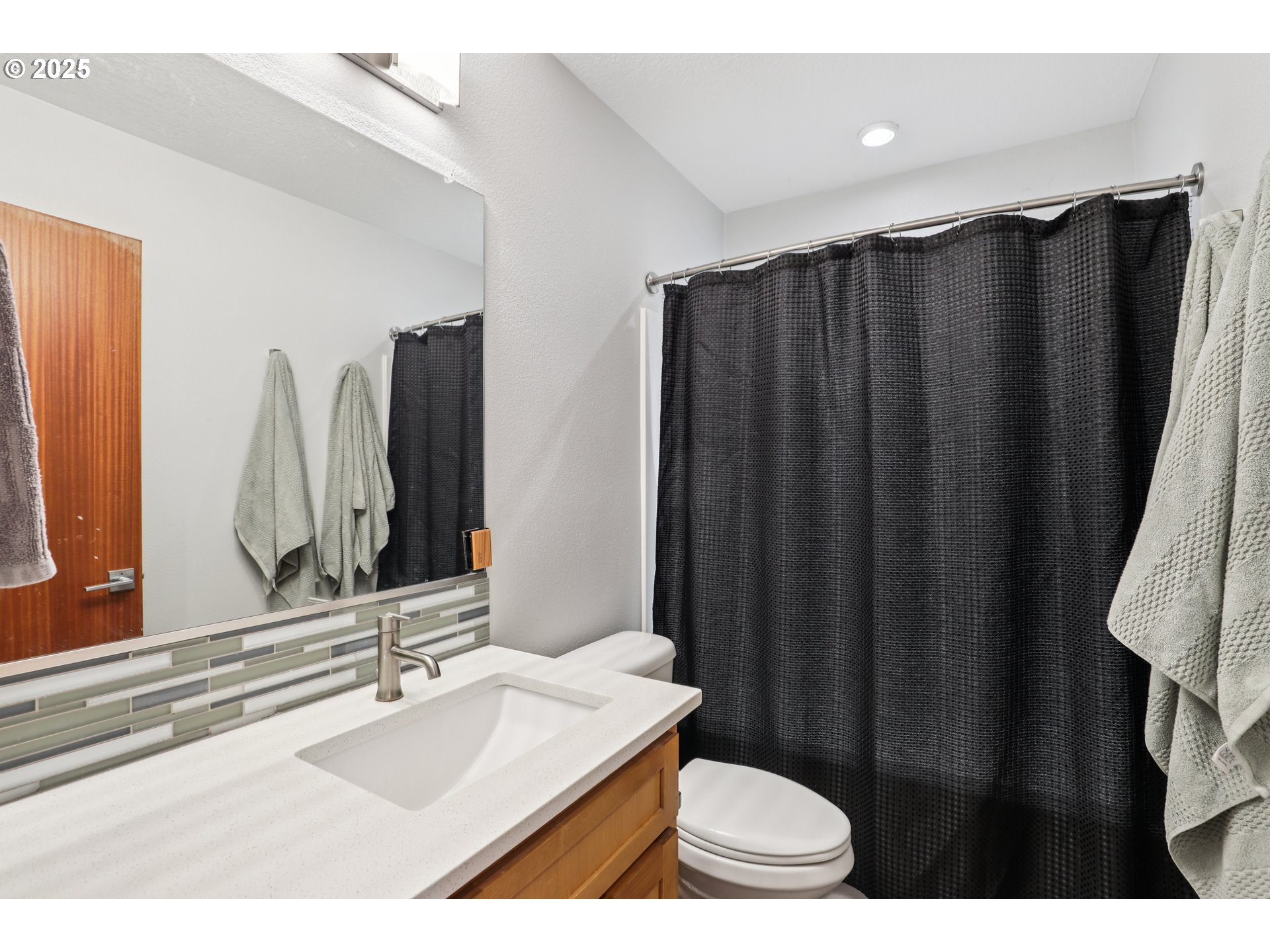 13005 South Casto Road Oregon City, OR 97045 - Photo 28 of 43 a bathroom with a sink and a mirror