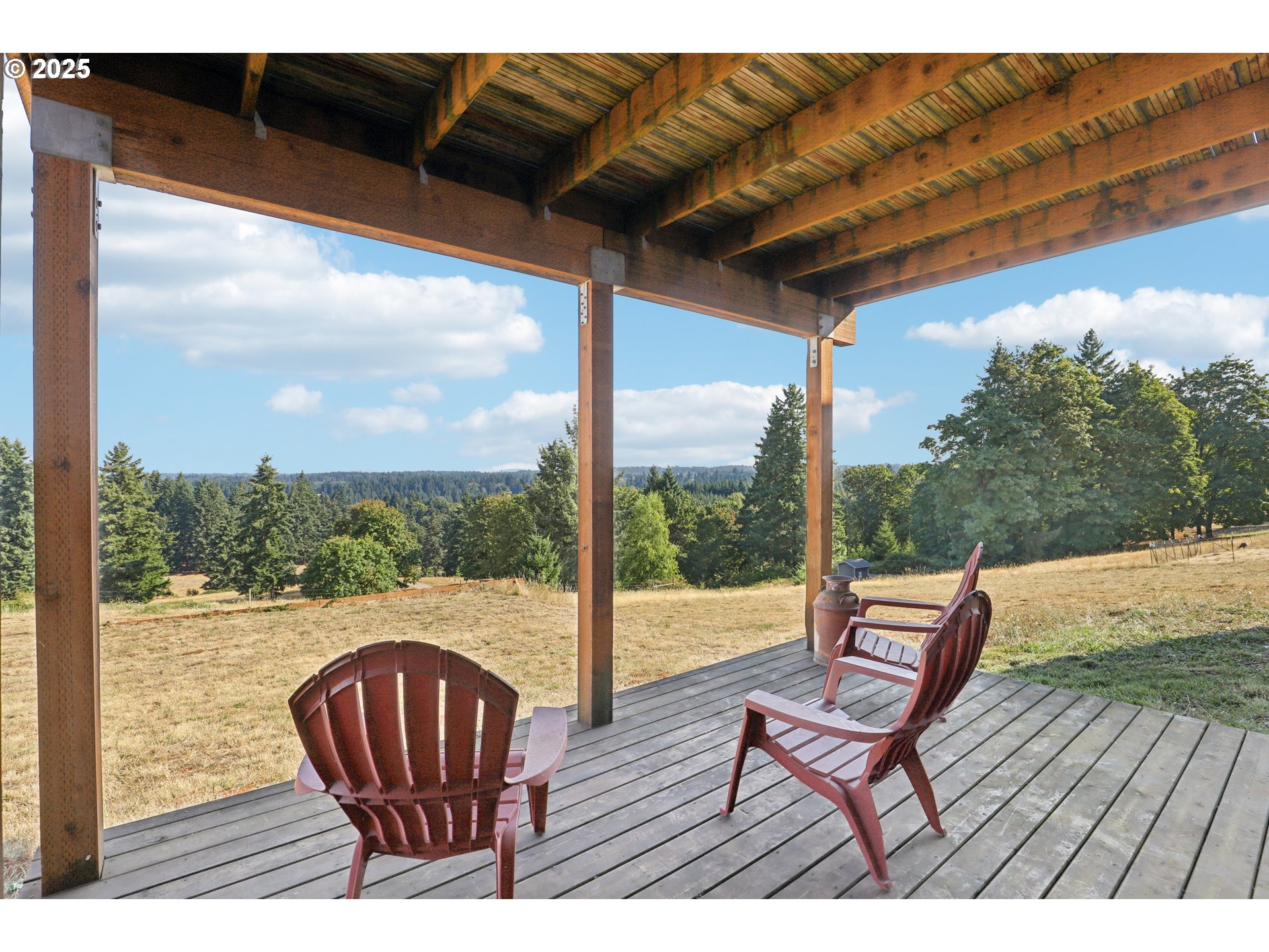 13005 South Casto Road Oregon City, OR 97045 - Photo 35 of 43 a view of balcony with wooden floor and outdoor seating