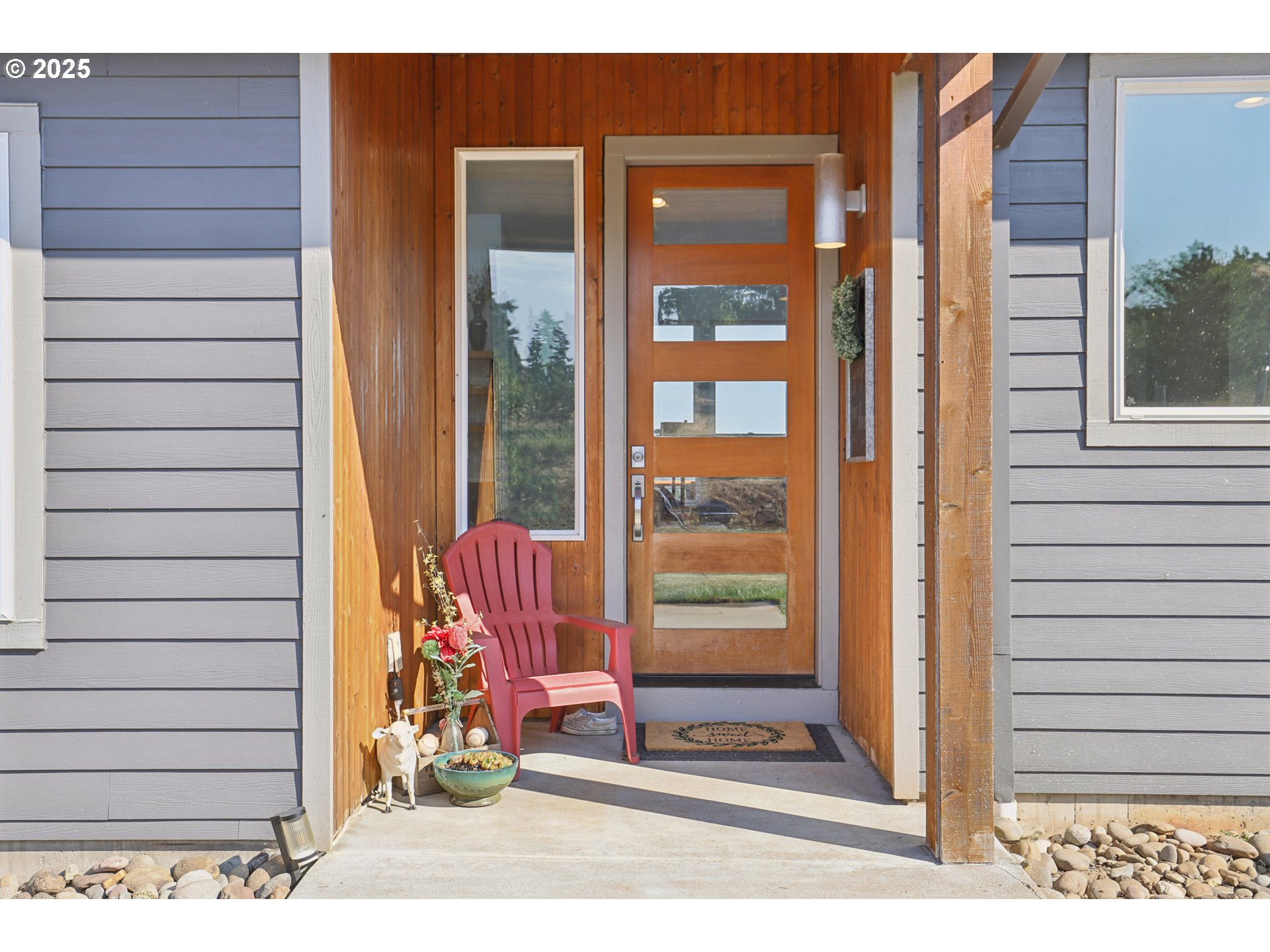 13005 South Casto Road Oregon City, OR 97045 - Photo 4 of 43 a view of a door and chair in the balcony