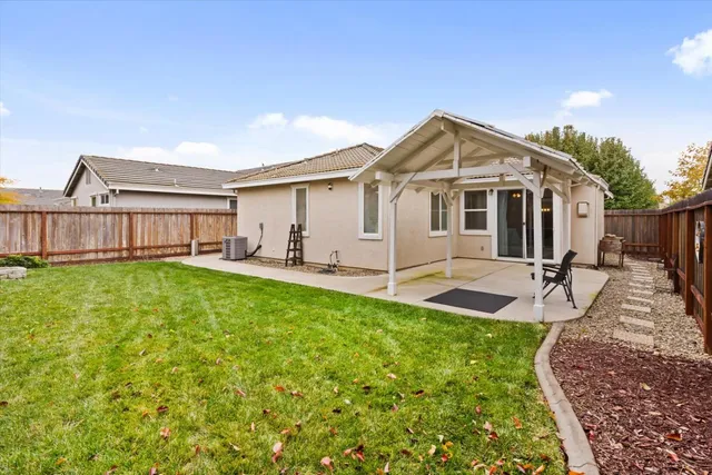 a view of a house with a yard porch and sitting area